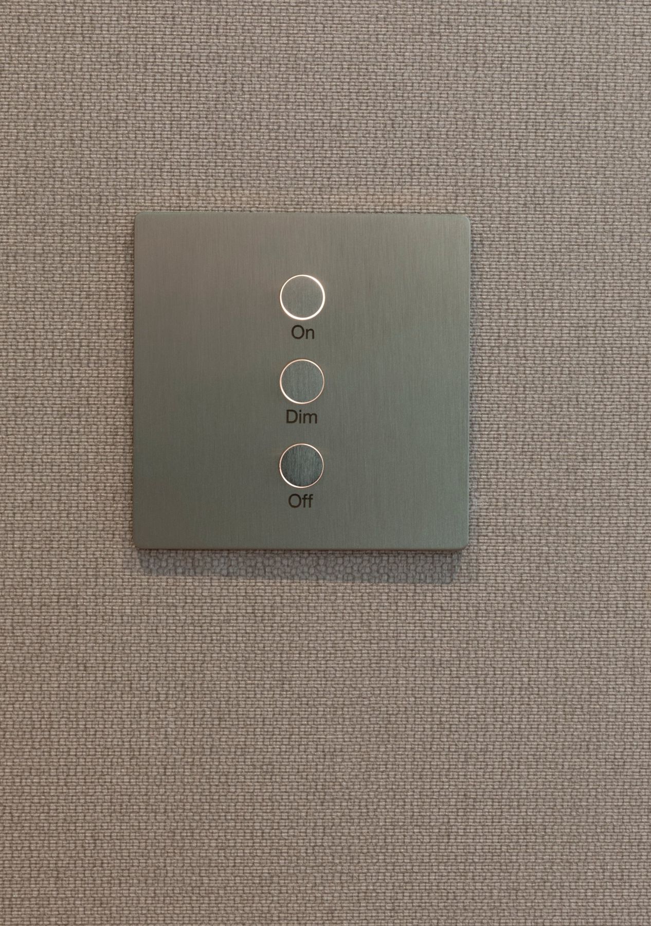Brushed metal keypad with three backlit buttons labeled On, Dim and Off