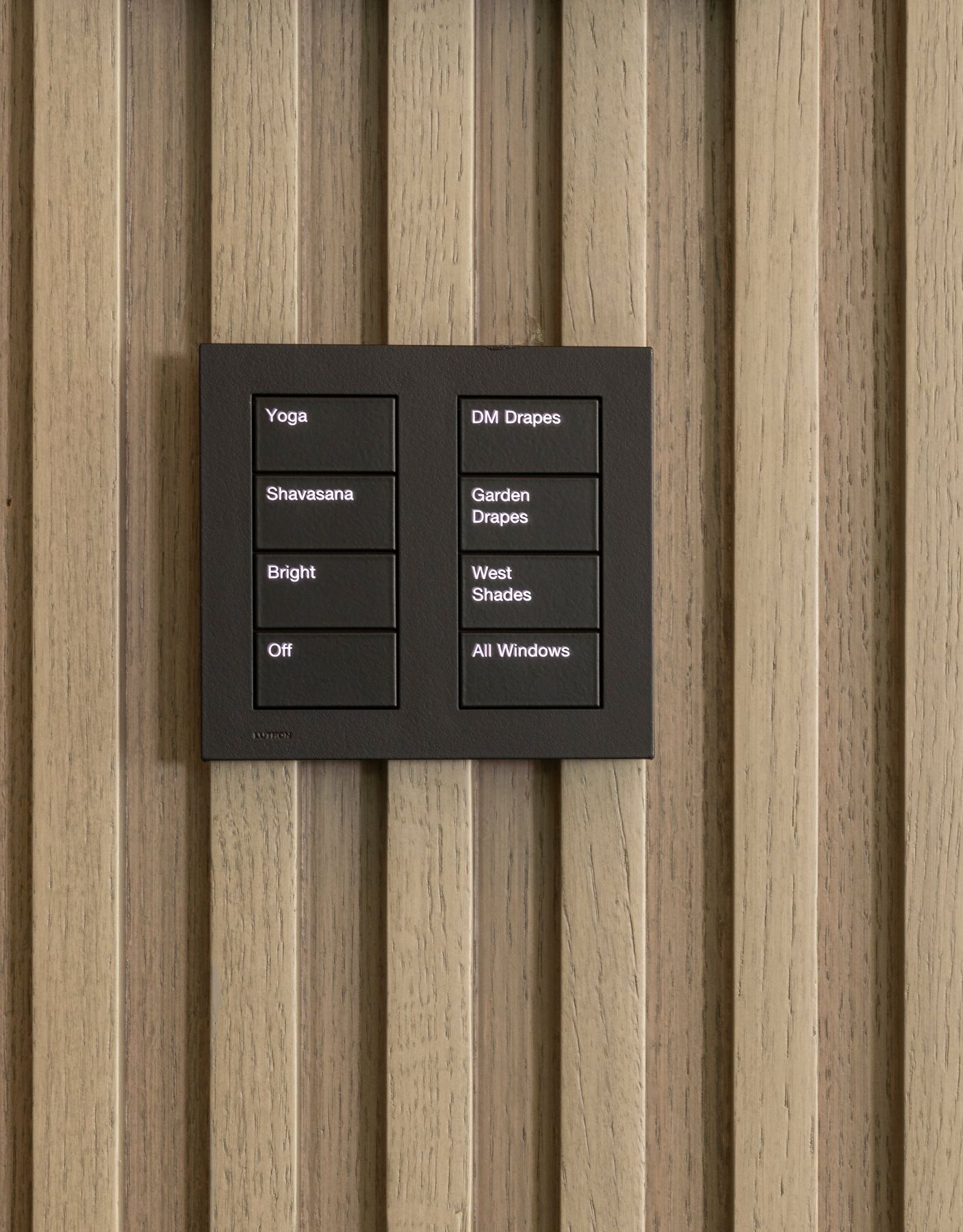 Black Lutron keypad on oak slats with buttons for Yoga, Shavasana, Bright, Off, DM Drapes, Garden Drapes, West Shades and All Windows